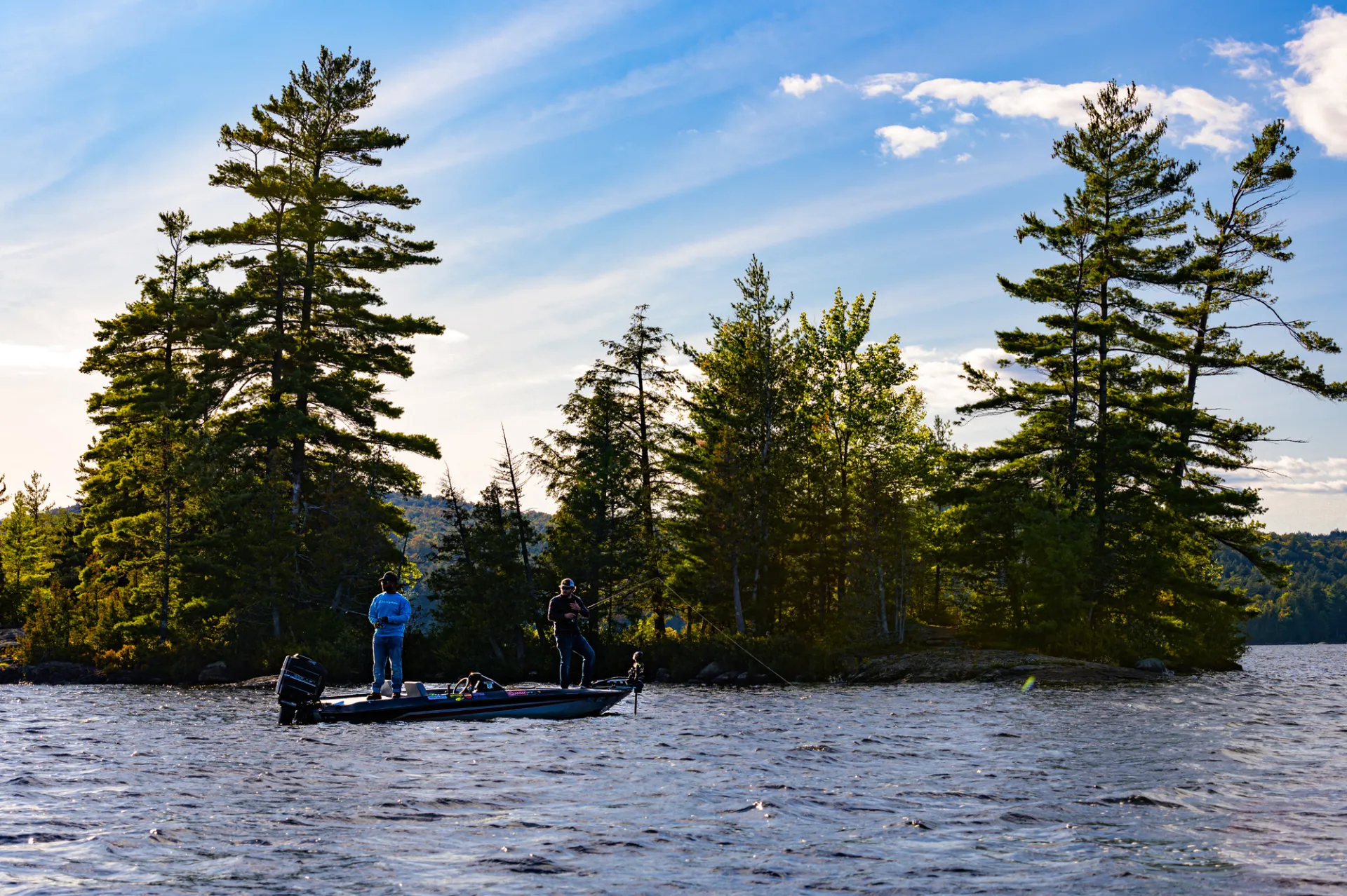 Scenic photo of people in a fishing boat.